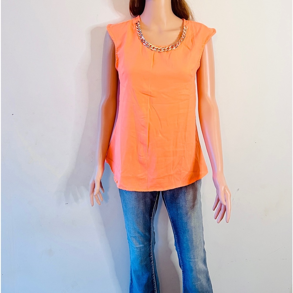 Brand new neon orange top with gold around the neck size S and M